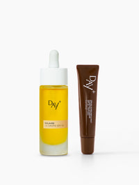 Duo SPF : flacon des UV Drops SPF 50 et tube du Sérum Lèvres Repulpant SPF 30 - Couleur 02.Light Brown.